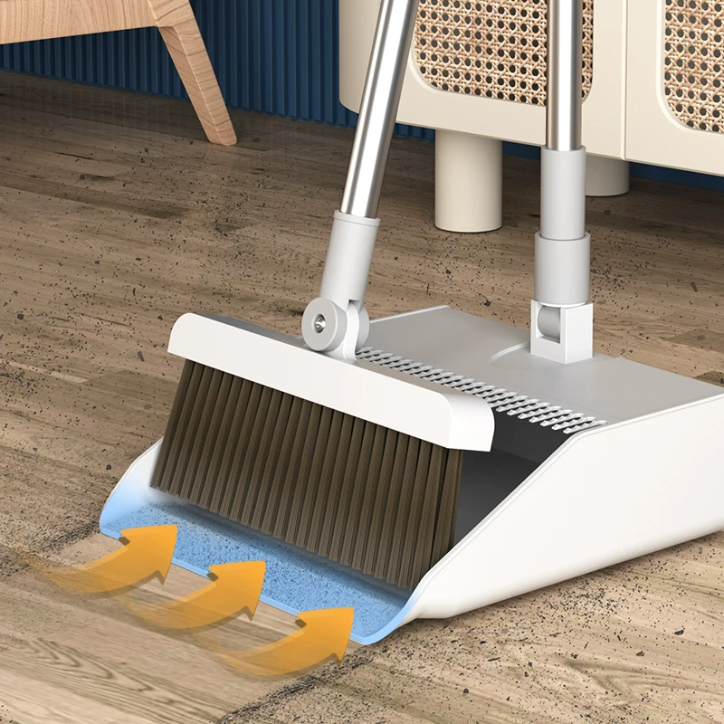 Close up of soft bristle broom sweeping dust and debris from SPC vinyl plank flooring surface before damp mopping showing proper dry cleaning step that prevents micro scratches during maintenance Close up of soft bristle broom sweeping dust and debris from SPC vinyl plank flooring surface before damp mopping showing proper dry cleaning step that prevents micro scratches during maintenance