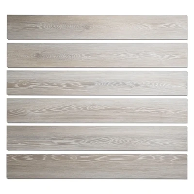 Five millimetre rigid core vinyl plank showing the layered construction of wear layer decor film and SPC core Five millimetre rigid core vinyl plank showing the layered construction of wear layer decor film and SPC core