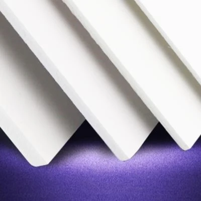 Cut-to-size white PVC sheets stacked and prepared for packing in a workshop Cut-to-size white PVC sheets stacked and prepared for packing in a workshop