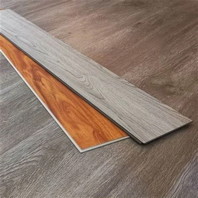 SPC vinyl plank flooring installed across an apartment floor area with plank joints running parallel SPC vinyl plank flooring installed across an apartment floor area with plank joints running parallel